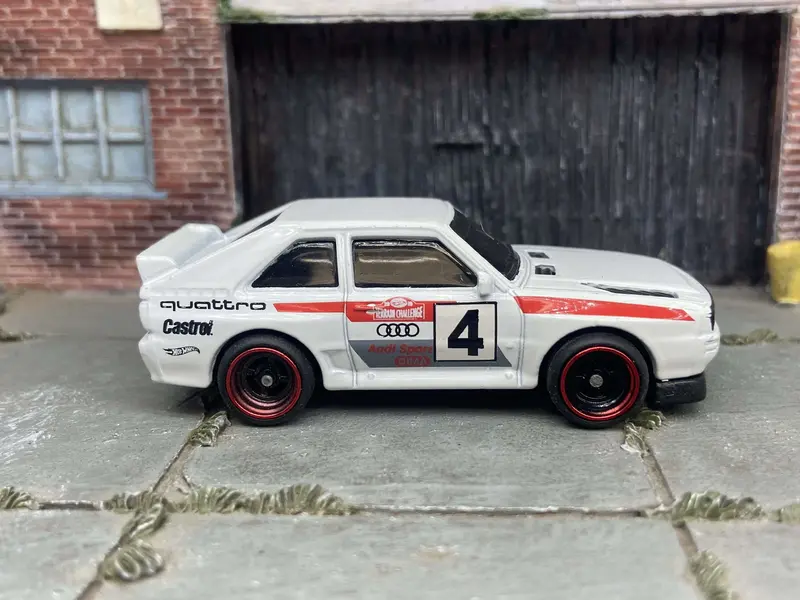 Custom Hot Wheels 1984 Audi Sport Quatro In White Red And Green Livery With Black And Red 4 Spoke Race Wheels With Rubber Tires 1