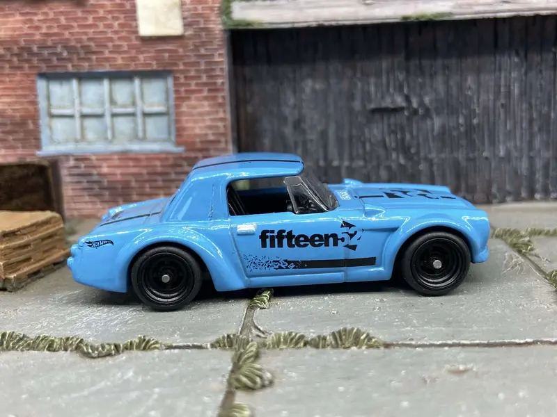 Custom Hot Wheels Fairlady 2000 In Blue And Black With Black 4 Spoke Wheels With Rubber Tires 1