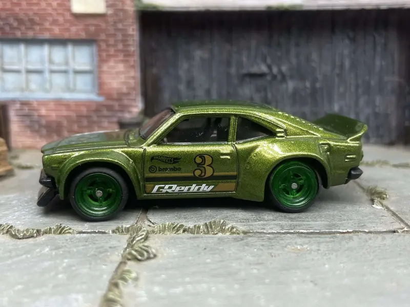 Custom Hot Wheels Mazda Rx-3 In Green With Green 4 Spoke Race Wheels With Rubber Tires 1