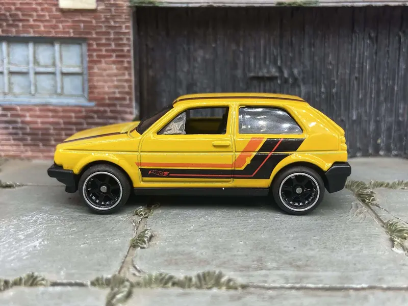 Custom Hot Wheels Vw Volkswagen Golf Mk2 In Yellow, Black And Orange With Black And Chrome 6 Spoke Studded Wheels And Rubber Tires 1
