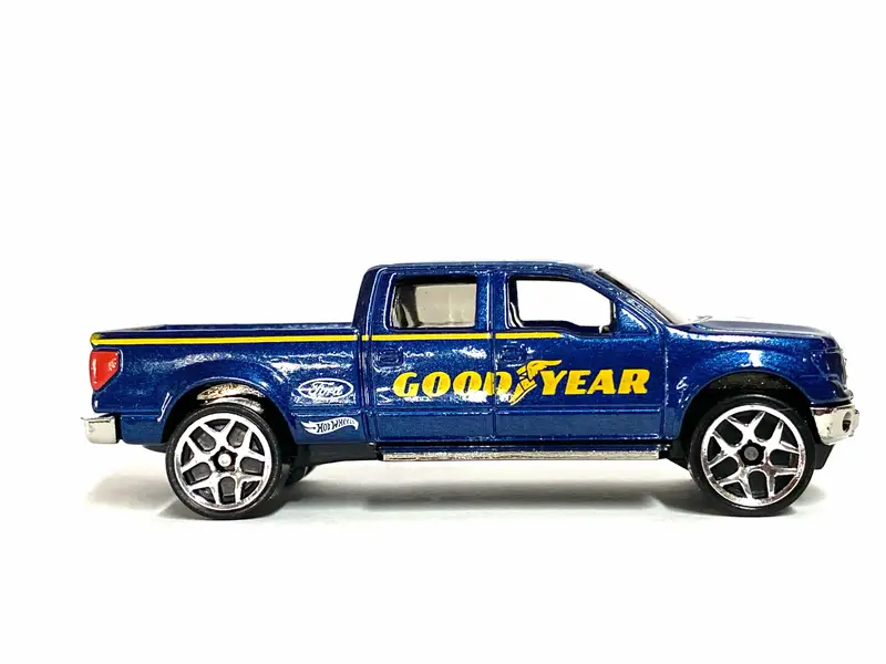 Loose Hot Wheels - 2009 Ford F150 - Blue And Yellow Goodyear Livery 1