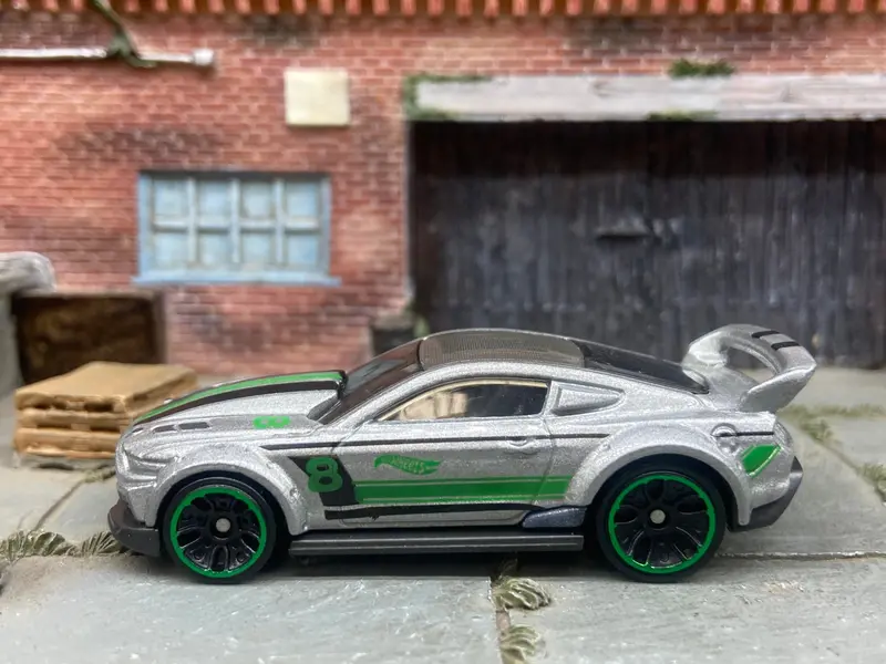 Loose Hot Wheels Custom 2015 Ford Mustang Race Car Dressed In Silver, Green And Black 1