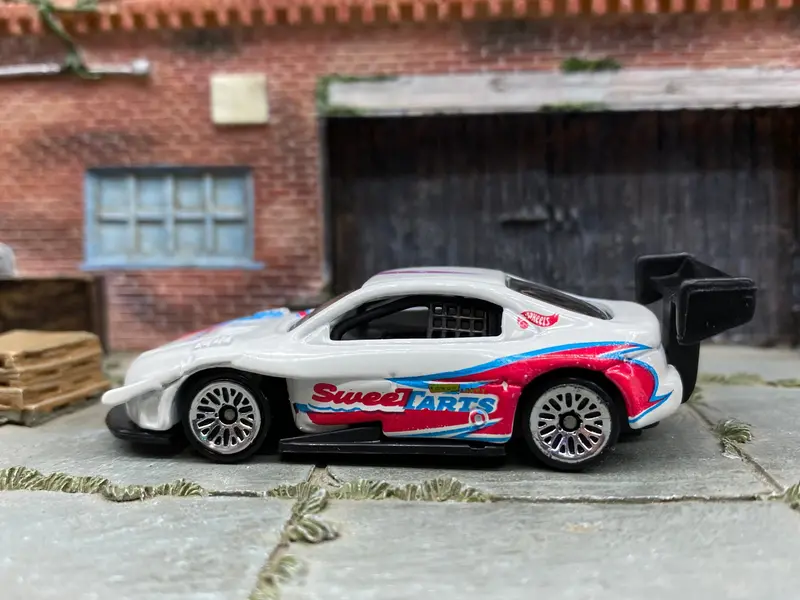 Loose Hot Wheels Pikes Peak Toyota Celica Race Car - White, Pink And Blue Sweettarts 1